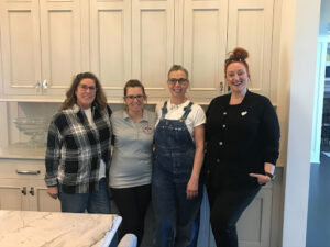4 ladies posed in kitchen